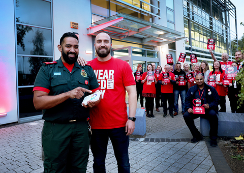 Shumel Rahman and Perry White press the button to turn the building red.png