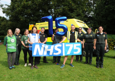 Saltwell Junior parkrunners celebrate NHS turning 75 with blue lights and sirens.png