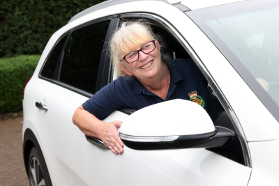 Janice Robinson, ACS Driver inside white car